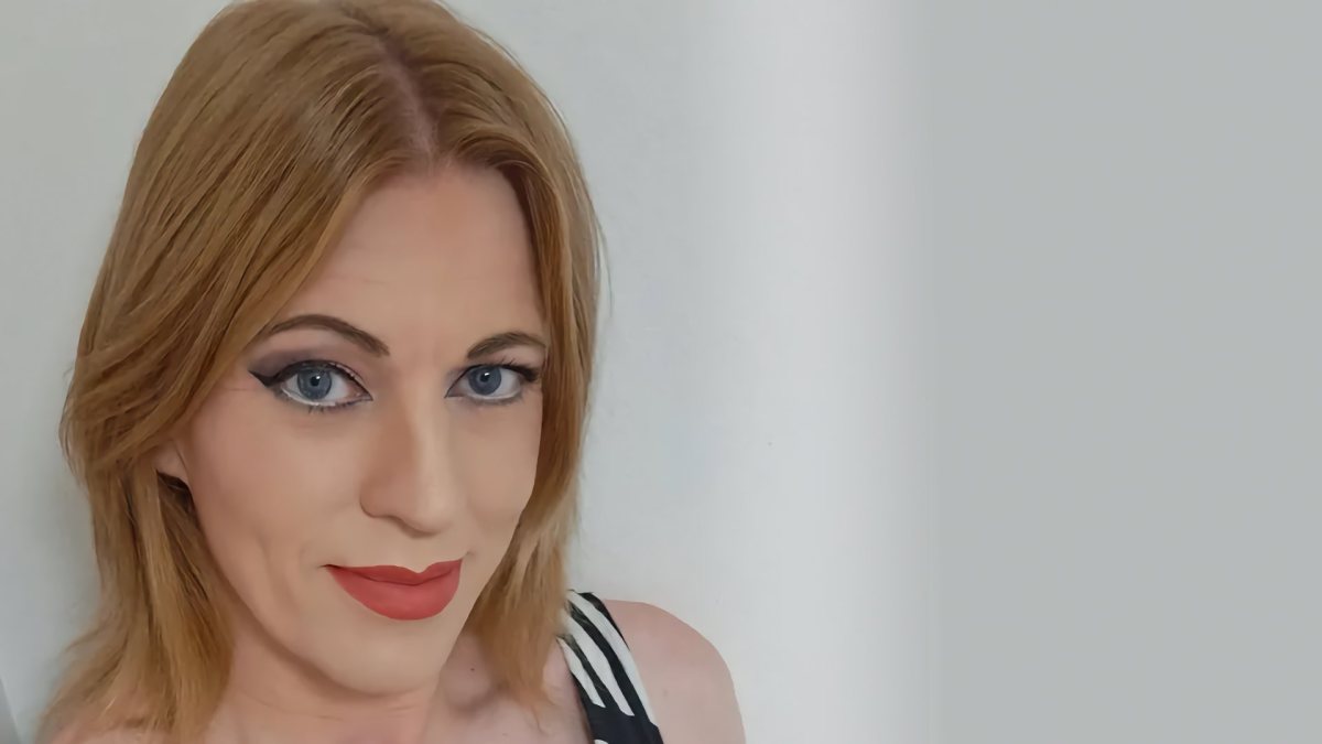 A head shot of Ami looking at the camera with a faint smile.